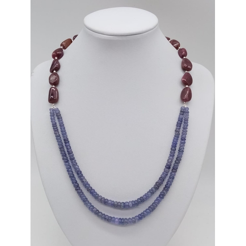 900 - 263cts two row cabochon tanzanite necklace with tumbled ruby beads. 52.8 grams in weight.44cm approx... 