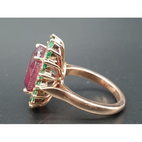 368 - A 9ct Ruby ring with a halo of emerald accents in 925 silver gold plating, weight 8g and size M1/2