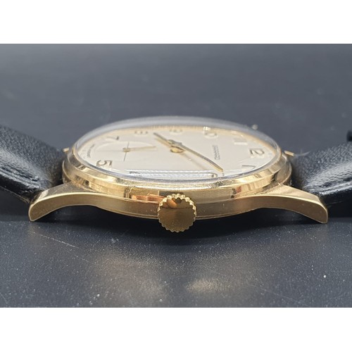 294 - A gents GARRARD watch, 35mm, with gilded bezel and back and “Mr Choyce