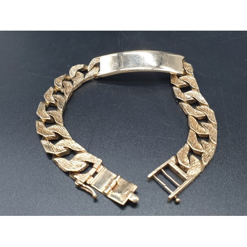 97 - A 9 carat, fully hallmarked, gents ID bracelet, with bark effect chain. Length: 23cm, weight: 54g.