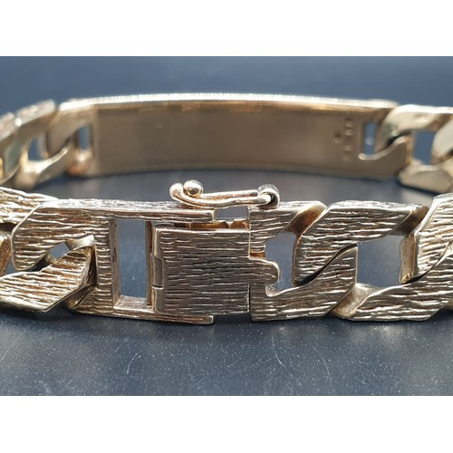 97 - A 9 carat, fully hallmarked, gents ID bracelet, with bark effect chain. Length: 23cm, weight: 54g.
