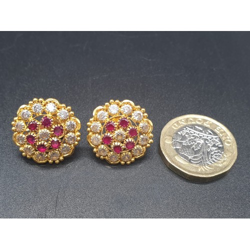 273 - A pair of 22 carat yellow gold earrings with clear and red stones (untested). Total weight: 6g.