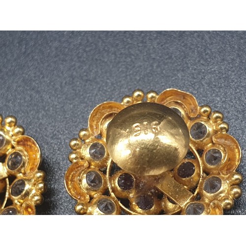 273 - A pair of 22 carat yellow gold earrings with clear and red stones (untested). Total weight: 6g.