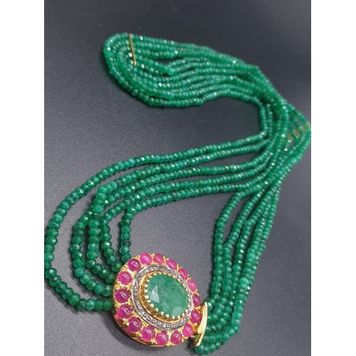 152 - A Five Row Green Onyx necklace with a Ruby clasp cum brooch with a halo of diamonds and rubies , 22 ... 