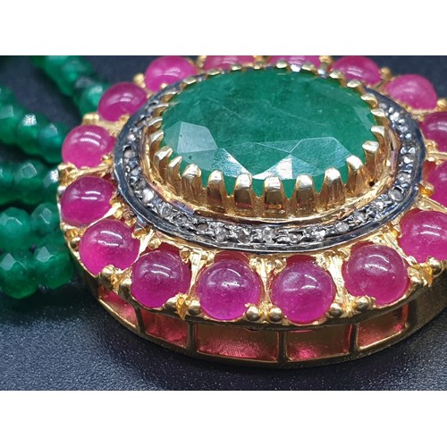 152 - A Five Row Green Onyx necklace with a Ruby clasp cum brooch with a halo of diamonds and rubies , 22 ... 