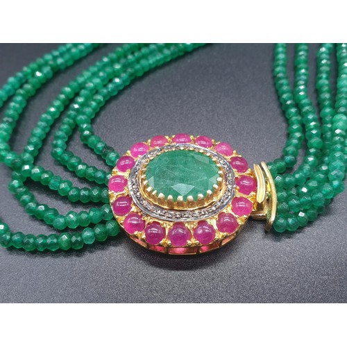 152 - A Five Row Green Onyx necklace with a Ruby clasp cum brooch with a halo of diamonds and rubies , 22 ... 