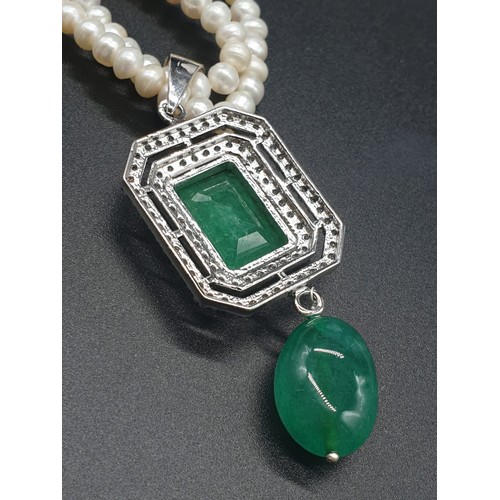 361 - Two row freshwater Pearl Necklace with emerald pendant , with emerald approx 10cts, 18 inches length