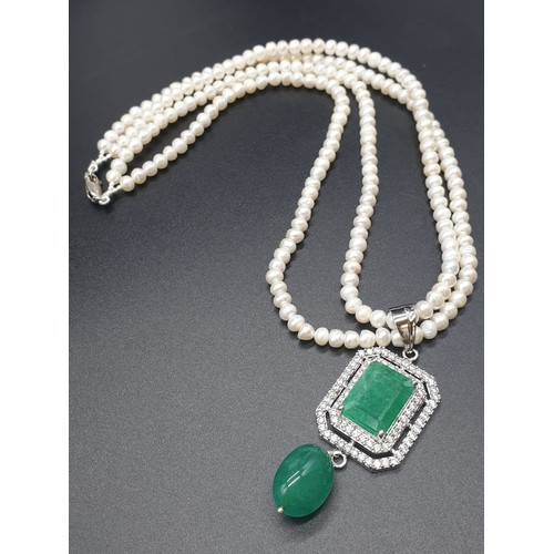 361 - Two row freshwater Pearl Necklace with emerald pendant , with emerald approx 10cts, 18 inches length