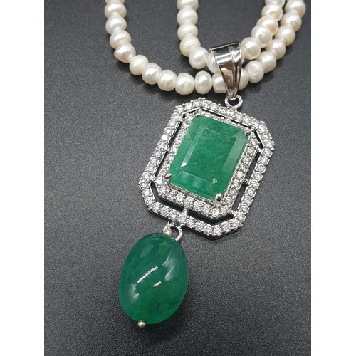 361 - Two row freshwater Pearl Necklace with emerald pendant , with emerald approx 10cts, 18 inches length