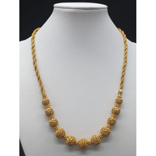 83 - A beautiful, 22 carat yellow gold, Indian style, necklace and earrings set. Necklace length: 45 cm, ... 