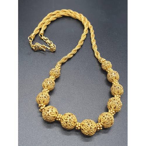 83 - A beautiful, 22 carat yellow gold, Indian style, necklace and earrings set. Necklace length: 45 cm, ... 