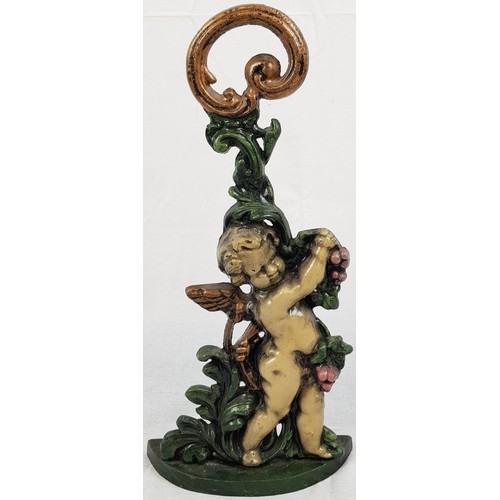 740 - A CAST IRON DOORSTOP IN THE SHAPE OF A CHERUB,
NICELY PAINTED. 41 cms TALL.