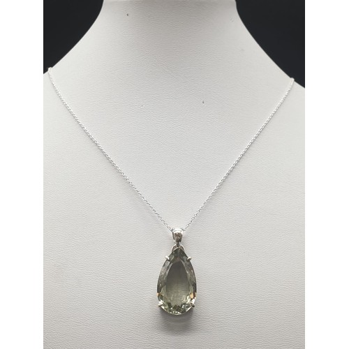 523 - A Green Amethyst gemstone pendant in sterling silver with chain