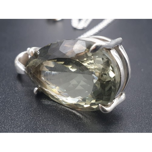 523 - A Green Amethyst gemstone pendant in sterling silver with chain