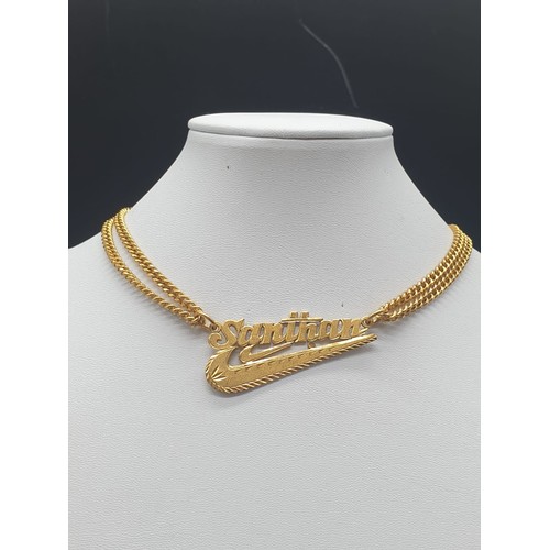 189 - A heavy 22 carat yellow gold chain with a personalised pendant. Chain length: 56cm. total weight: 42... 