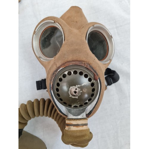 188 - 1939 Dated British Army Gas Mask in desert colour and case. Includes de-misting kit and emergency ey... 