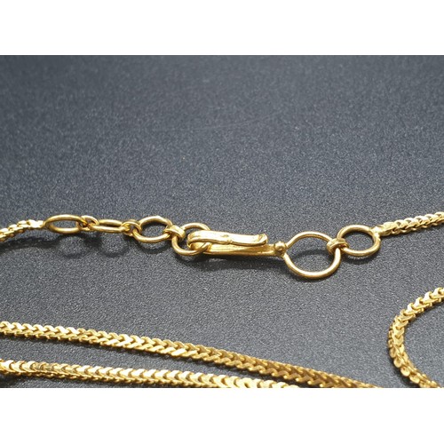 191 - A refined 21 carat yellow gold, Indian style chain with pendant. Chain length:  44cm, total weight: ... 