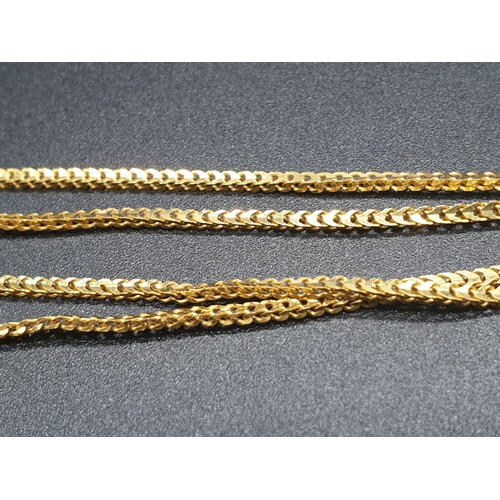 191 - A refined 21 carat yellow gold, Indian style chain with pendant. Chain length:  44cm, total weight: ... 