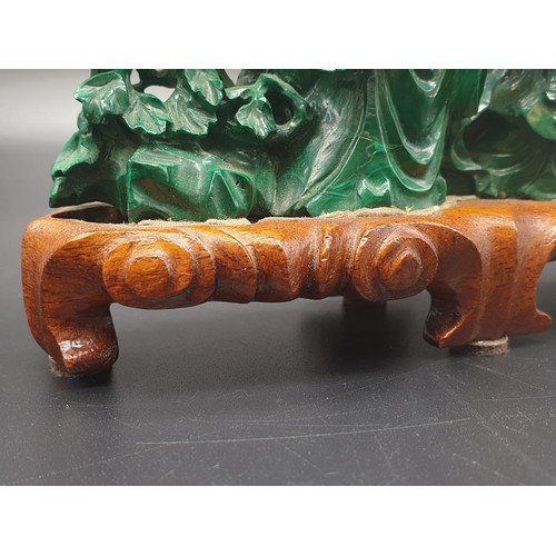 275 - CHINESE HAND CARVED MALACHITE WITH FIGURES ,FLOWERS AND ROCKERY ON ORIGINAL ROSEWOOD BASE  15.5CMS X... 