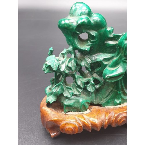 275 - CHINESE HAND CARVED MALACHITE WITH FIGURES ,FLOWERS AND ROCKERY ON ORIGINAL ROSEWOOD BASE  15.5CMS X... 