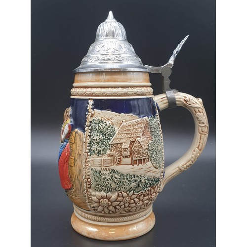 756 - A NICELY DECORATED BAVARIAN BEER STEIN WITH FLIP LID IN WHITE METAL.
21cms HIGH