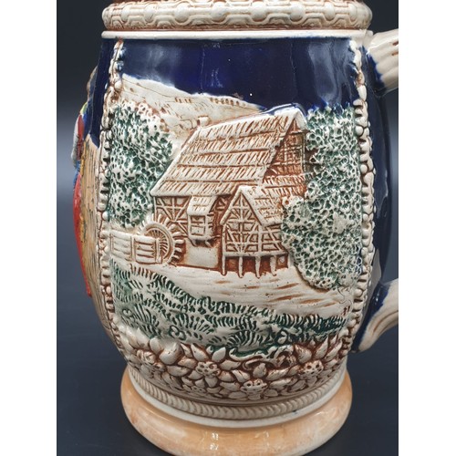 756 - A NICELY DECORATED BAVARIAN BEER STEIN WITH FLIP LID IN WHITE METAL.
21cms HIGH