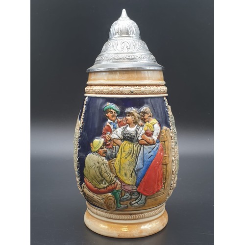 756 - A NICELY DECORATED BAVARIAN BEER STEIN WITH FLIP LID IN WHITE METAL.
21cms HIGH