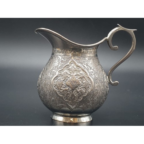 256 - Persian Islamic solid silver jug hallmarked on base  103.9g. Height: 7.3cm