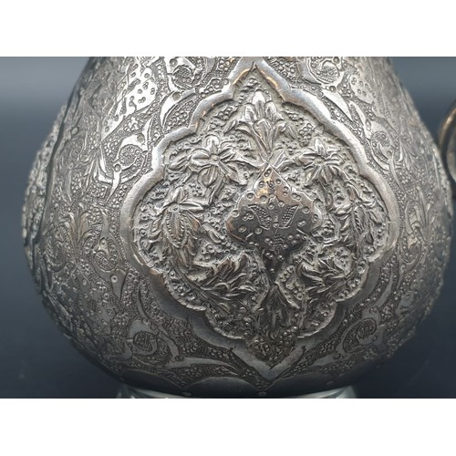 256 - Persian Islamic solid silver jug hallmarked on base  103.9g. Height: 7.3cm