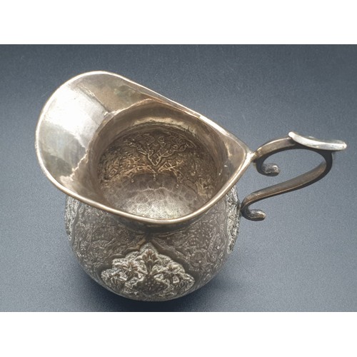 256 - Persian Islamic solid silver jug hallmarked on base  103.9g. Height: 7.3cm