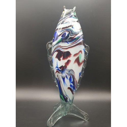 768 - A MULTI COLOURED GLASS FISH VASE/FLOWER HOLDER, STANDING 35.5cms  and 14cms wide