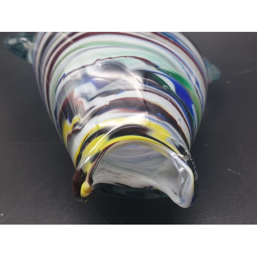 768 - A MULTI COLOURED GLASS FISH VASE/FLOWER HOLDER, STANDING 35.5cms  and 14cms wide