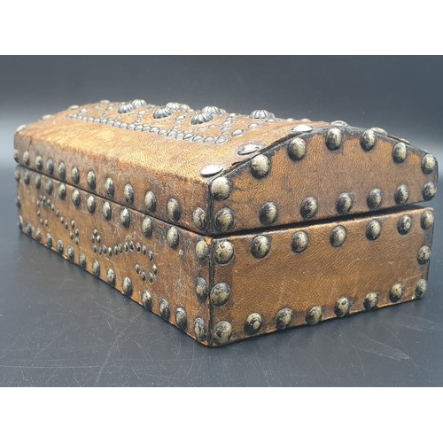 769 - AN ANTIQUE LEATHER BOUND STUDDED TRINKET BOX.
13 X 24CMS