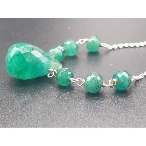 159 - A collection of emerald drops necklace with matching earrings and emerald ring size O