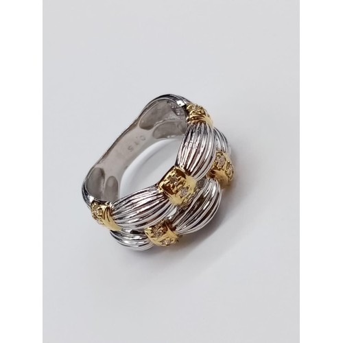 223 - 18ct White Gold RING trimmed with Yellow Gold and Diamonds. 8.6g   Size: L