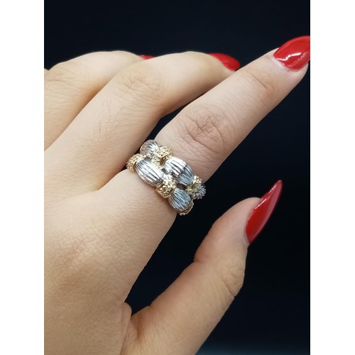 223 - 18ct White Gold RING trimmed with Yellow Gold and Diamonds. 8.6g   Size: L