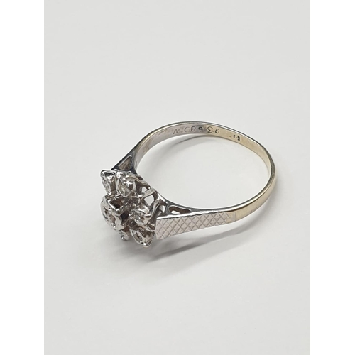 833 - 9ct Gold and Diamond RING in flower design.  2.9g  Size: O