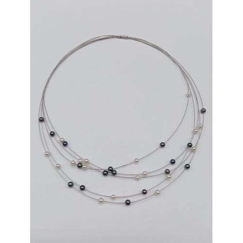 845 - Elegant and delicate Pearl NECKLACE with various shades of pearls, set in 18ct white Gold.   9g    4... 