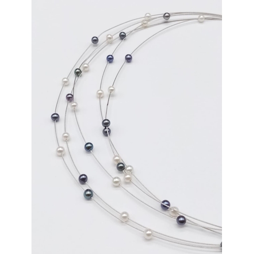 845 - Elegant and delicate Pearl NECKLACE with various shades of pearls, set in 18ct white Gold.   9g    4... 