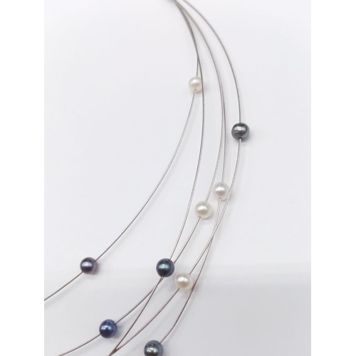 845 - Elegant and delicate Pearl NECKLACE with various shades of pearls, set in 18ct white Gold.   9g    4... 