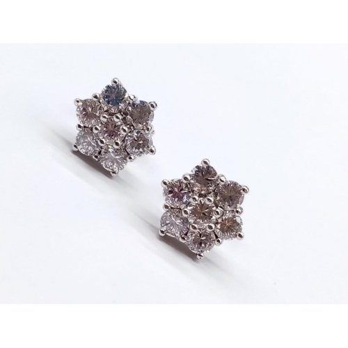 854 - Pair of 9ct White Gold and CZ stones EARRINGS in a floral design.  2.5g    1cm width.