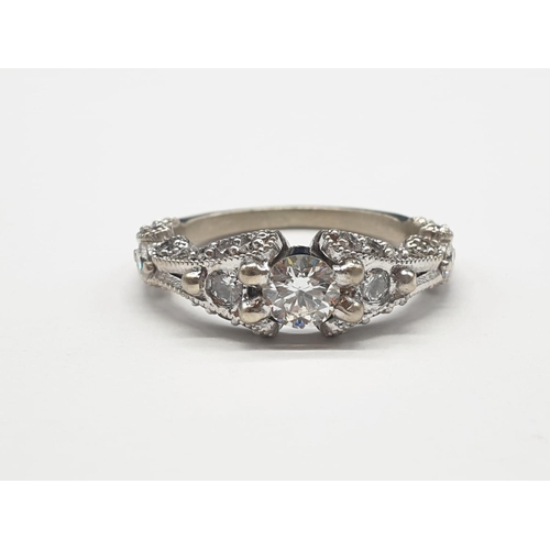 527 - Platinum Hand Crafted Diamond RING with approx 0.5 ct diamond centre and further diamond setting on ... 