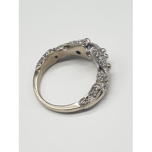 527 - Platinum Hand Crafted Diamond RING with approx 0.5 ct diamond centre and further diamond setting on ... 