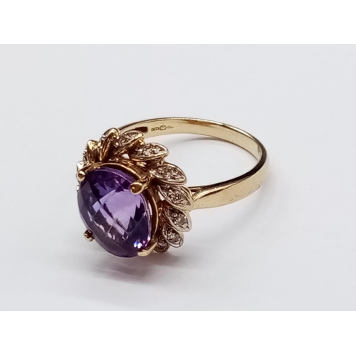 535 - 9ct Yellow Gold RING with large Amethyst centre.   3.6g  Size:  N 1/2