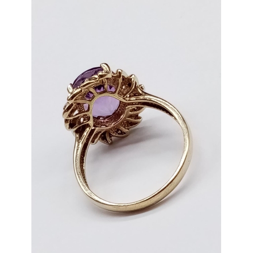 535 - 9ct Yellow Gold RING with large Amethyst centre.   3.6g  Size:  N 1/2