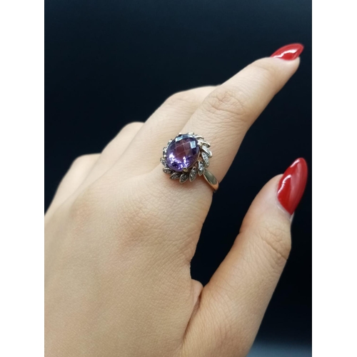 535 - 9ct Yellow Gold RING with large Amethyst centre.   3.6g  Size:  N 1/2