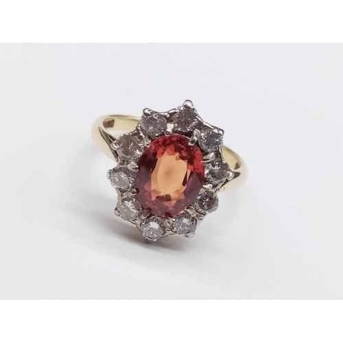 402 - 18ct Yellow Gold RING with a large African natural Ruby centre and surrounded with approx 1ct of Dia... 