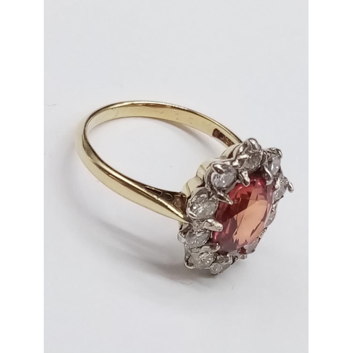 402 - 18ct Yellow Gold RING with a large African natural Ruby centre and surrounded with approx 1ct of Dia... 