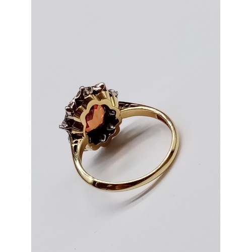 402 - 18ct Yellow Gold RING with a large African natural Ruby centre and surrounded with approx 1ct of Dia... 