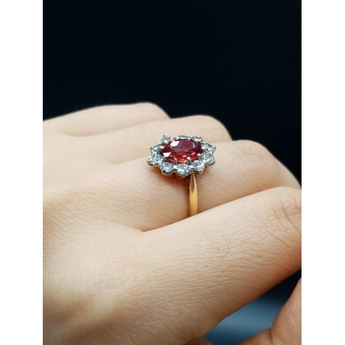 402 - 18ct Yellow Gold RING with a large African natural Ruby centre and surrounded with approx 1ct of Dia... 